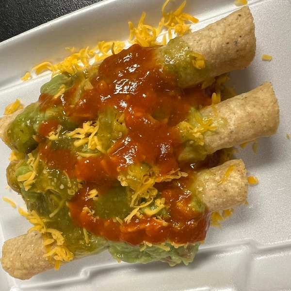 Rolled tacos with guacamole